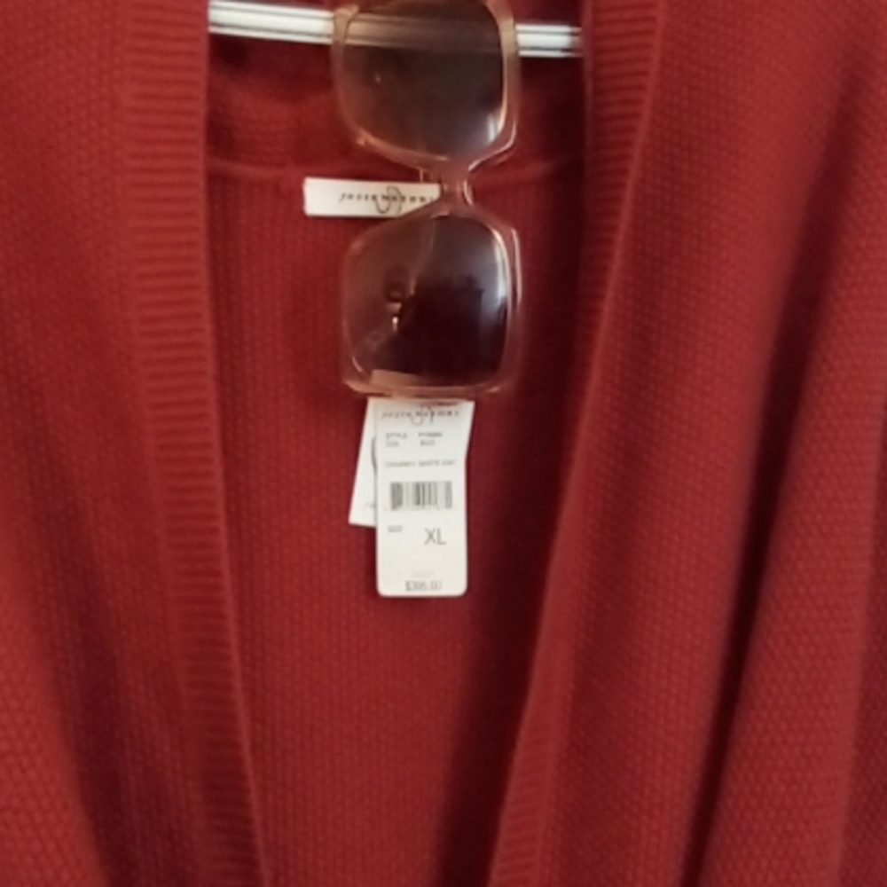 Josie Natori knit sleeveless knit sweater.